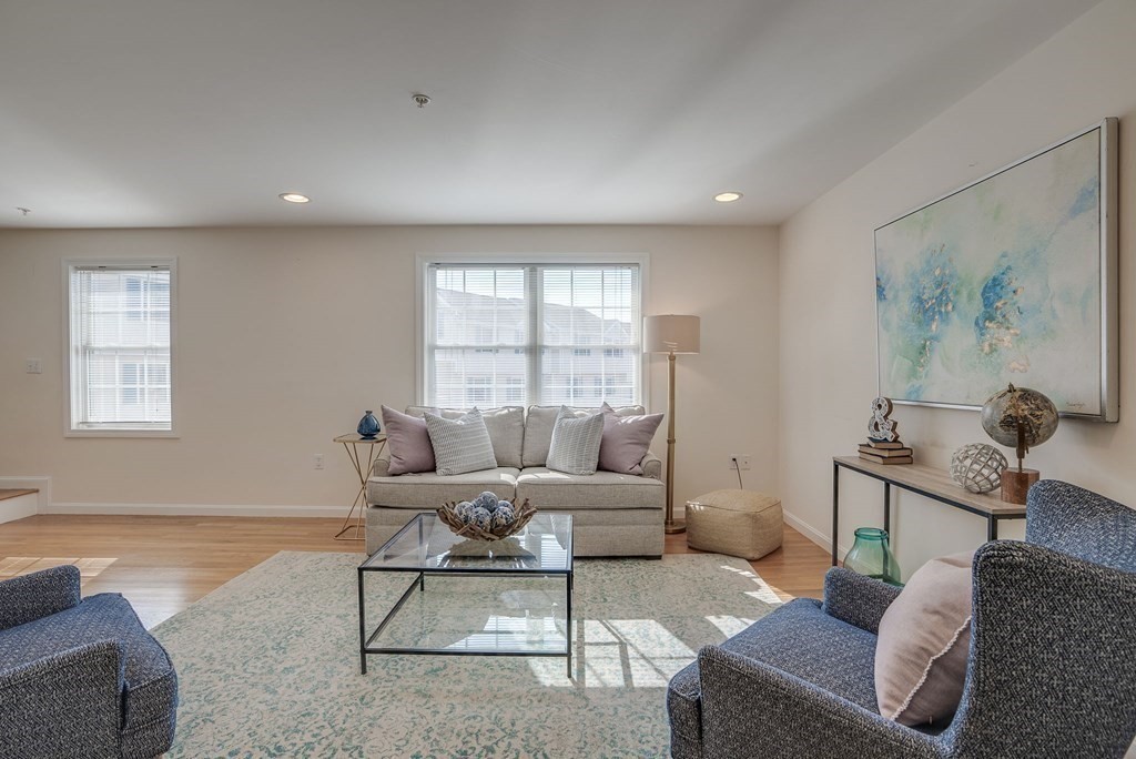 985 Trapelo Road, Unit 22 Waltham, MA 02452 - Photo 8 of 29 a living room with furniture and a window