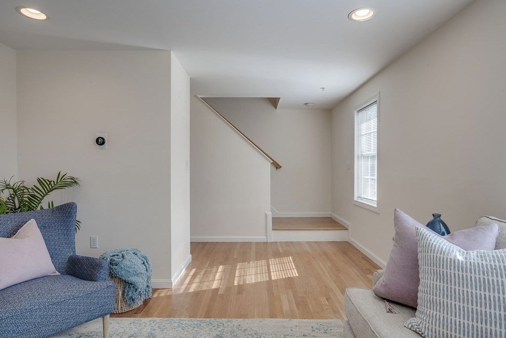 985 Trapelo Road, Unit 22 Waltham, MA 02452 - Photo 9 of 29 a living room with furniture and a potted plant