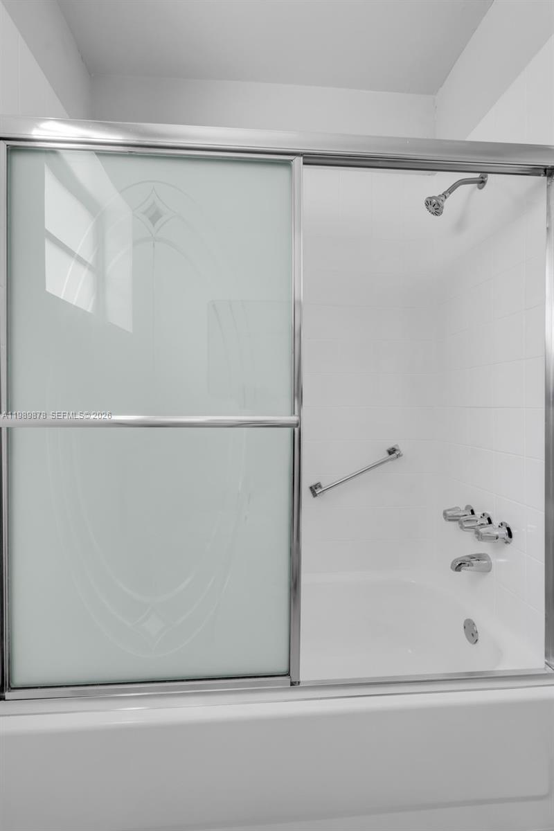 4485 East 8th Avenue Hialeah, FL 33013 - Photo 12 of 26 a bathroom with a shower