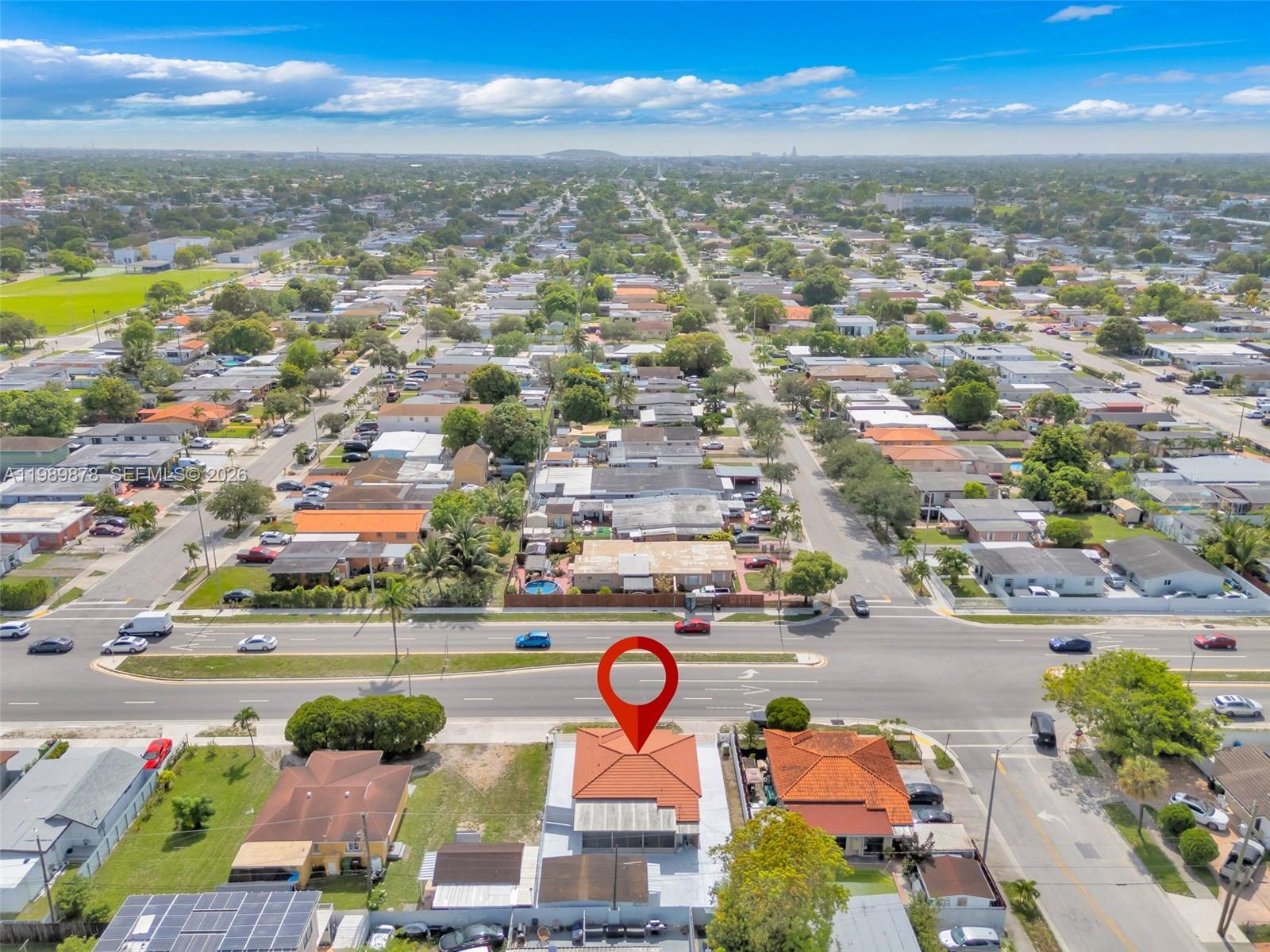 4485 East 8th Avenue Hialeah, FL 33013 - Photo 24 of 26 an aerial view of residential houses with outdoor space and ocean view