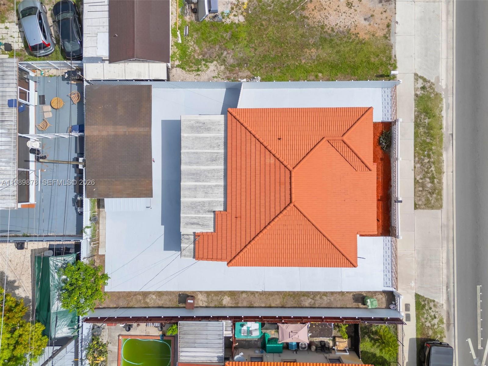 4485 East 8th Avenue Hialeah, FL 33013 - Photo 26 of 26 an aerial view of a house with swimming pool