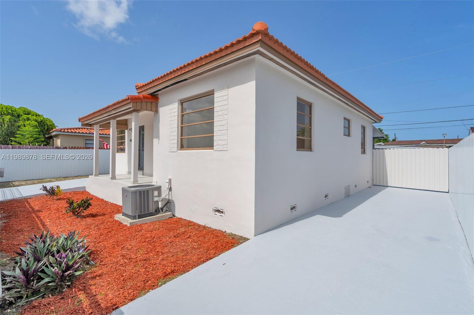 4485 East 8th Avenue Hialeah, FL 33013 - Photo 3 of 26 a front view of house with an outdoor space