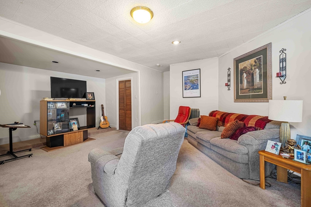 403 Allen Street Springfield, MA 01118 - Photo 4 of 24 a living room with furniture and a flat screen tv