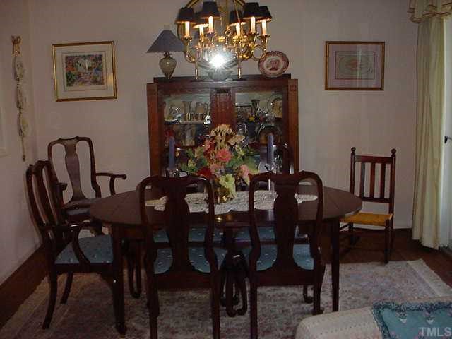 51 Stoneridge Road Durham, NC 27705 - Photo 3 of 10 a view of a dining room with furniture and a chandelier