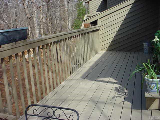 51 Stoneridge Road Durham, NC 27705 - Photo 7 of 10 a balcony with wooden floor in front of it