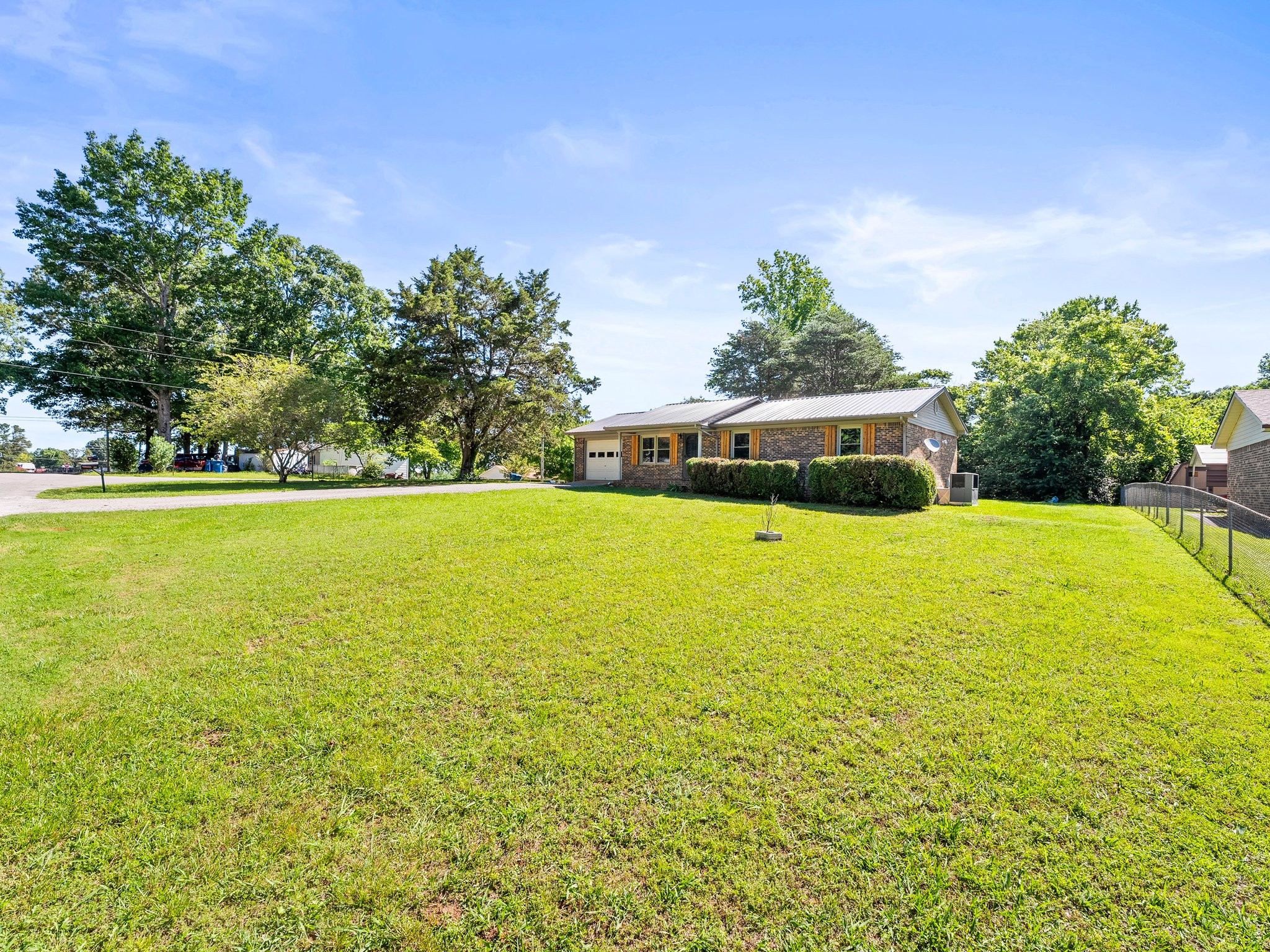 103 Cedar Street Huntland, TN 37345 - Photo 2 of 26 a view of yard with swimming pool and green space