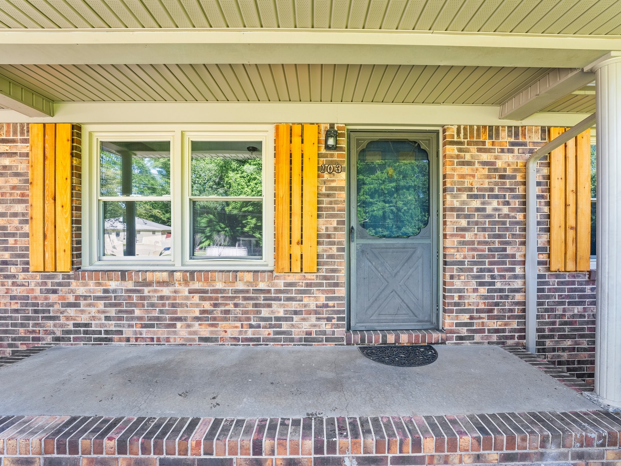103 Cedar Street Huntland, TN 37345 - Photo 5 of 26 a front view of a house with a garden