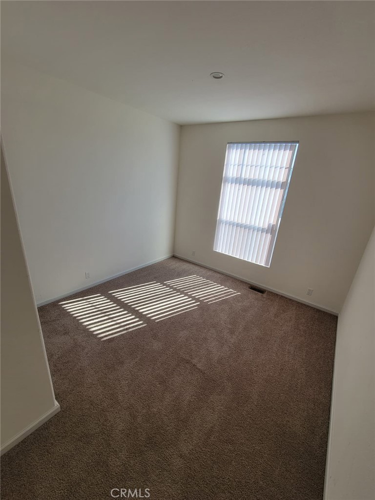 55 Pacifica Avenue, Unit 77 Bay Point, CA 94565 - Photo 7 of 10 an empty room with a window