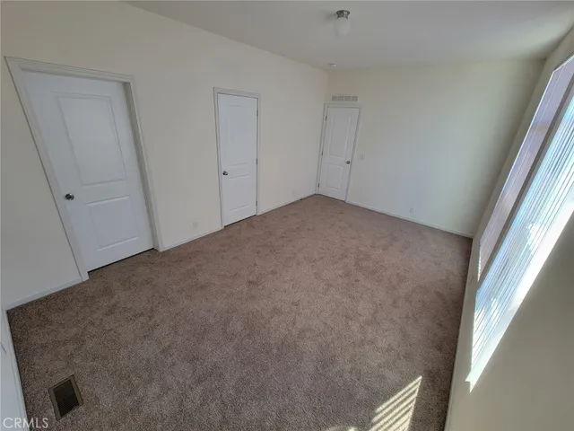 a view of a hallway view with staircase