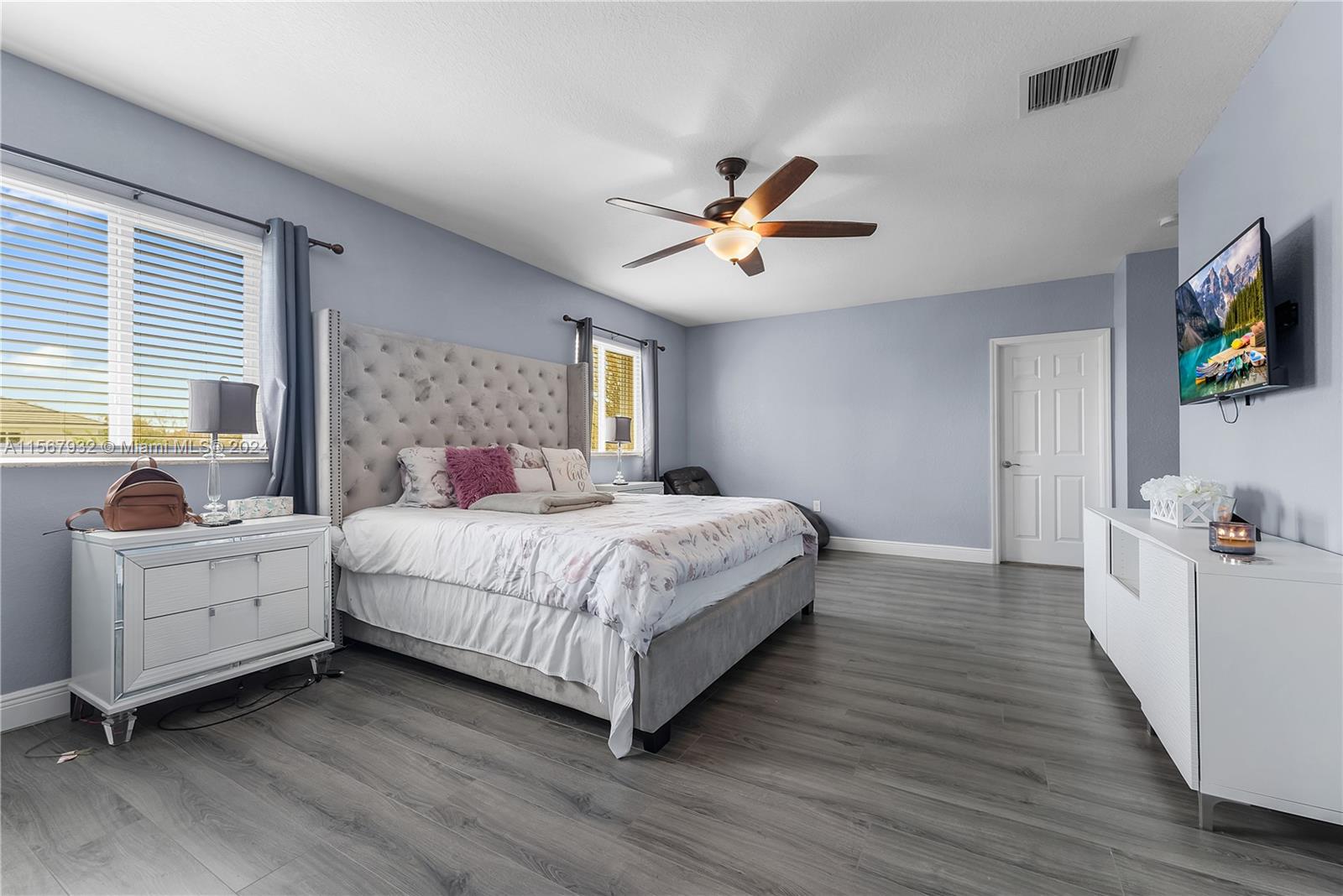 657 Southeast 30th Terrace Homestead, FL 33033 - Photo 22 of 53 a bedroom with a bed and a flat screen tv