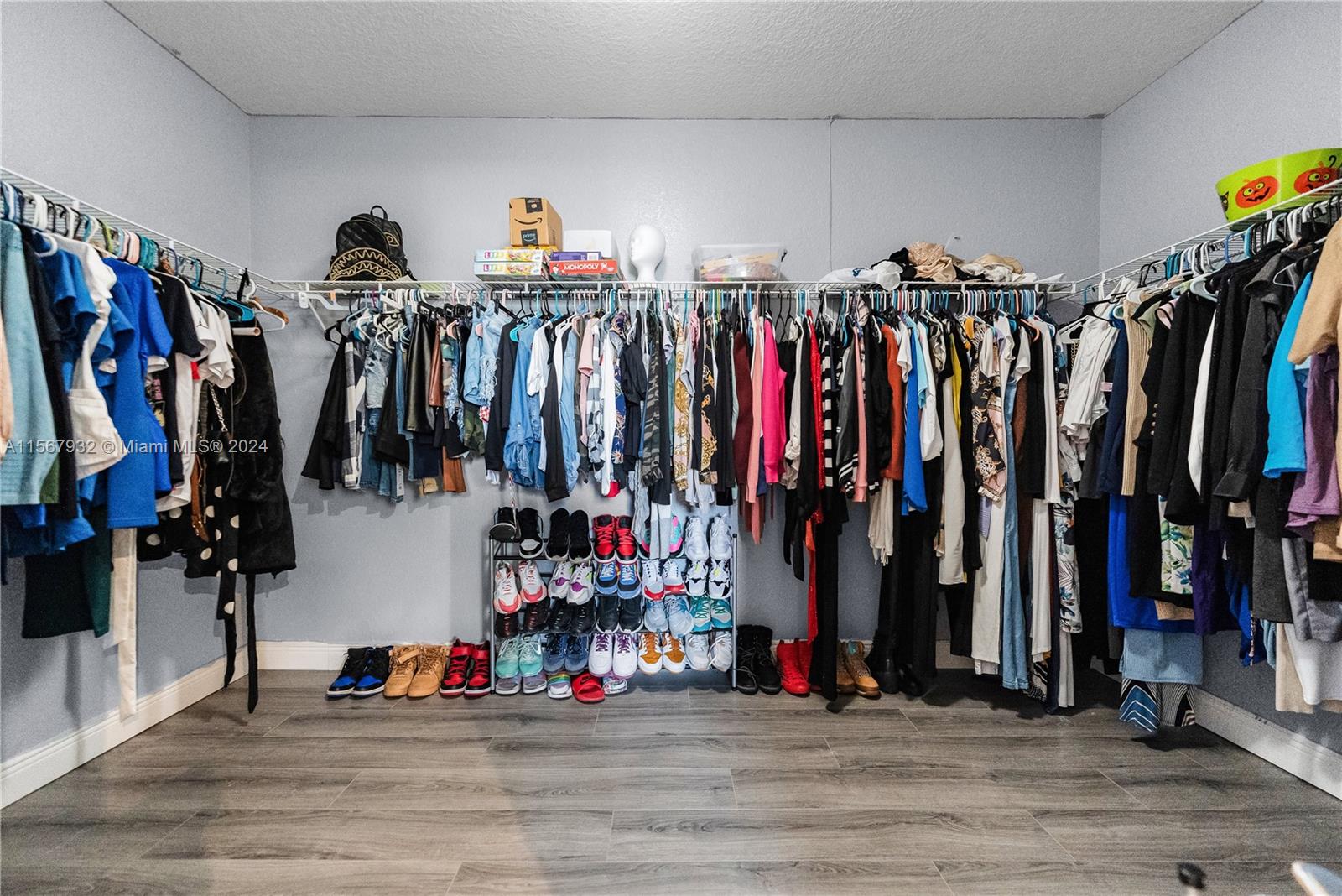 657 Southeast 30th Terrace Homestead, FL 33033 - Photo 26 of 53 a view of walk in closet with clothes