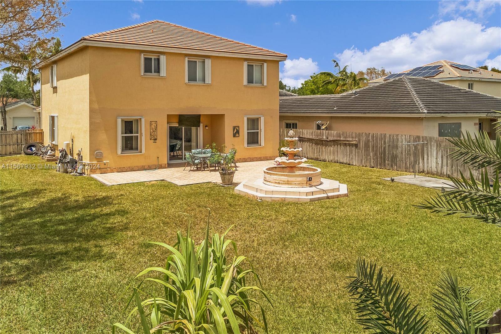 657 Southeast 30th Terrace Homestead, FL 33033 - Photo 29 of 53 a view of a house with a swimming pool