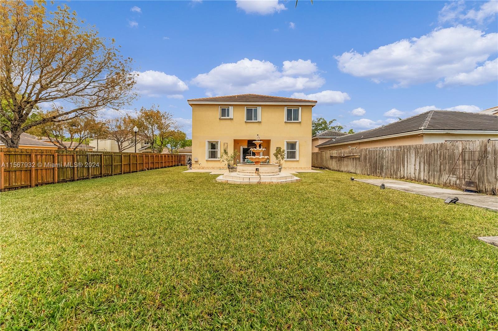 657 Southeast 30th Terrace Homestead, FL 33033 - Photo 35 of 53 a view of a house with a big yard