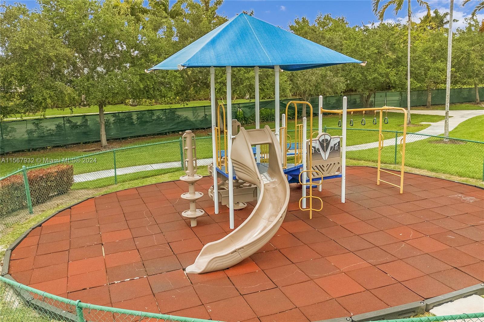657 Southeast 30th Terrace Homestead, FL 33033 - Photo 50 of 53 a view of a wooden deck with chairs and a yard