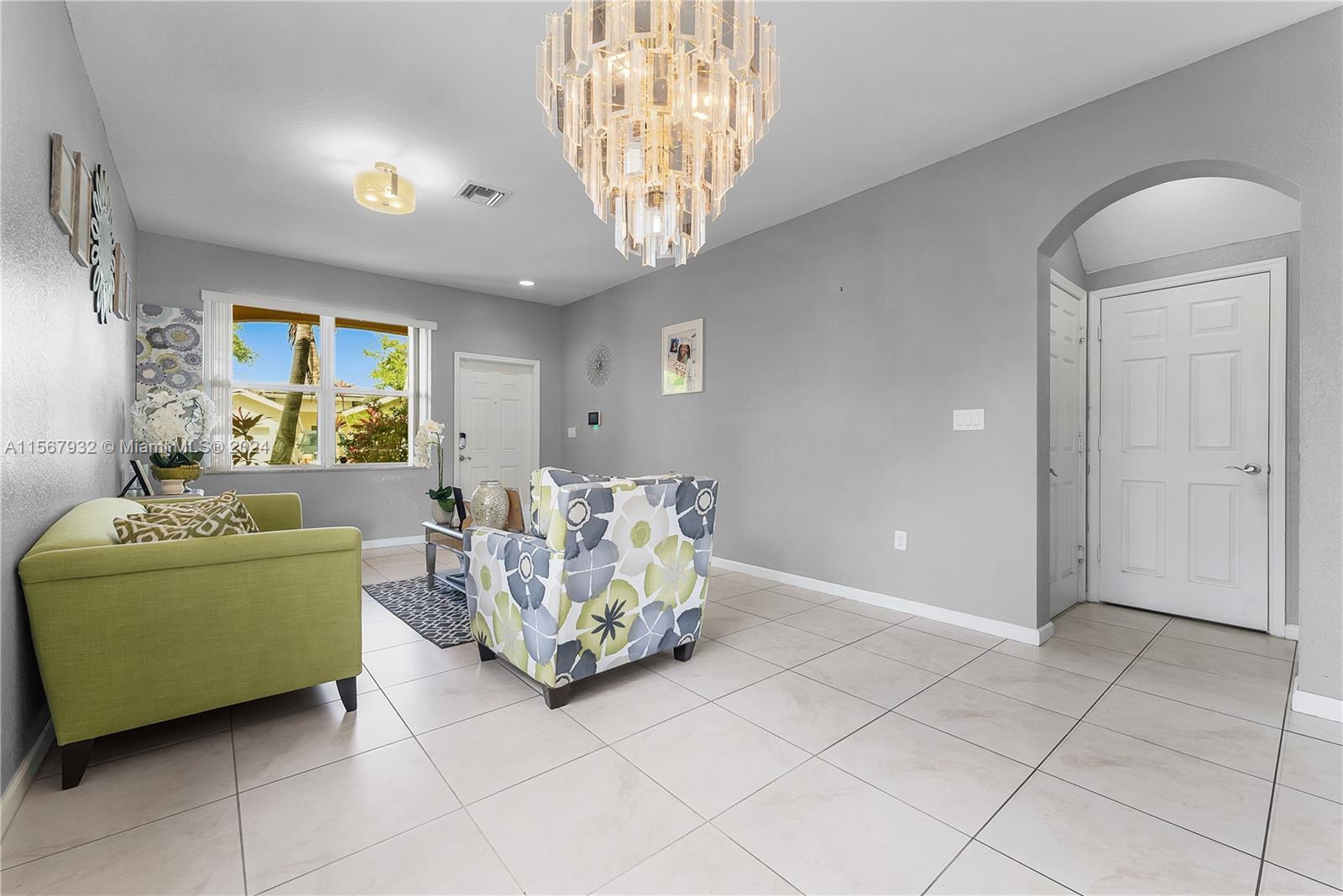 657 Southeast 30th Terrace Homestead, FL 33033 - Photo 5 of 53 a living room with furniture and a window