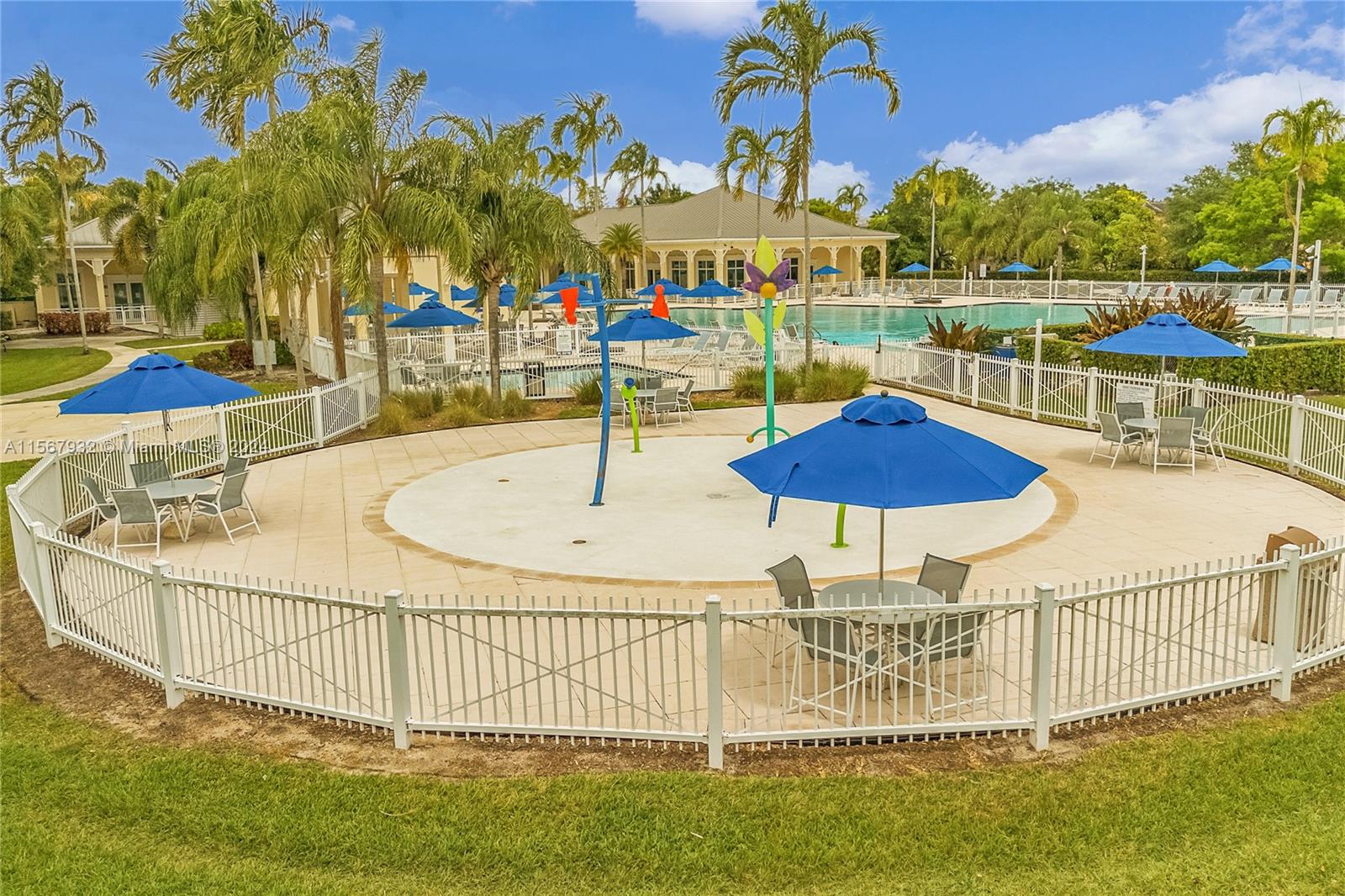 657 Southeast 30th Terrace Homestead, FL 33033 - Photo 51 of 53 a view of a swimming pool with a table and chairs
