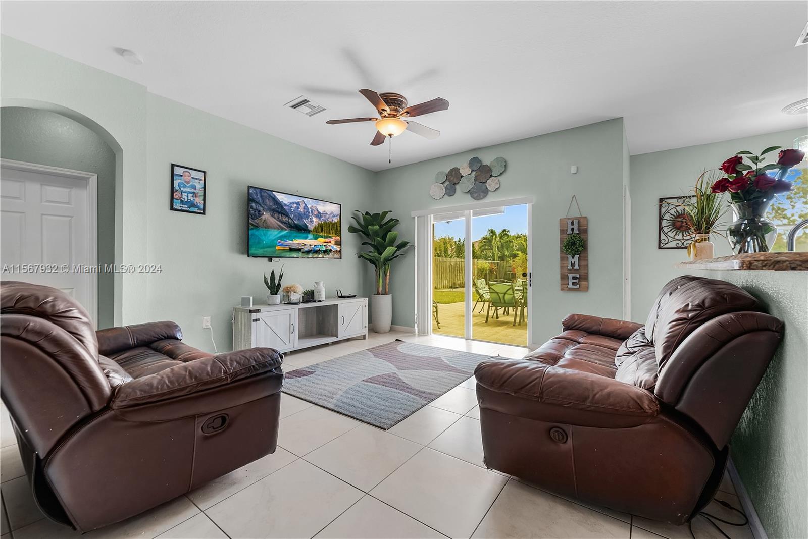 657 Southeast 30th Terrace Homestead, FL 33033 - Photo 7 of 53 a living room with furniture and a flat screen tv