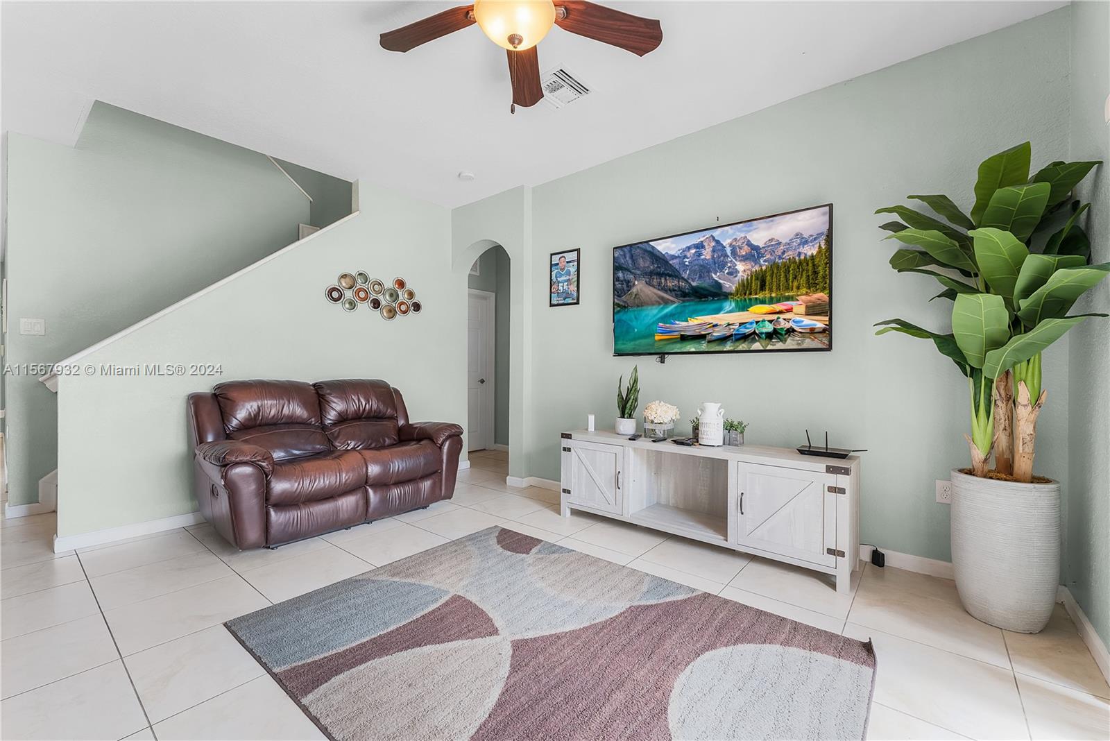 657 Southeast 30th Terrace Homestead, FL 33033 - Photo 8 of 53 a living room with furniture and a flat screen tv