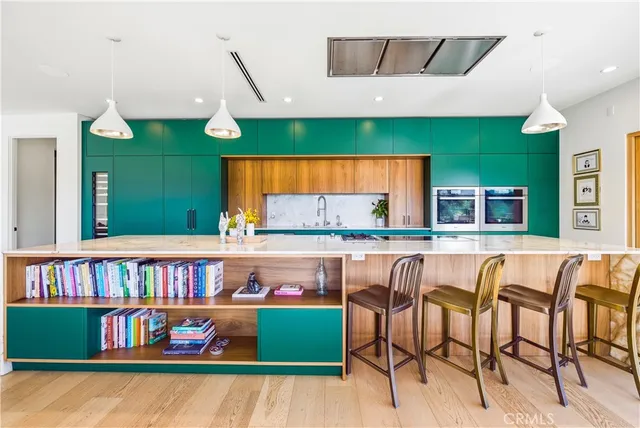 a living room with furniture and a book shelf