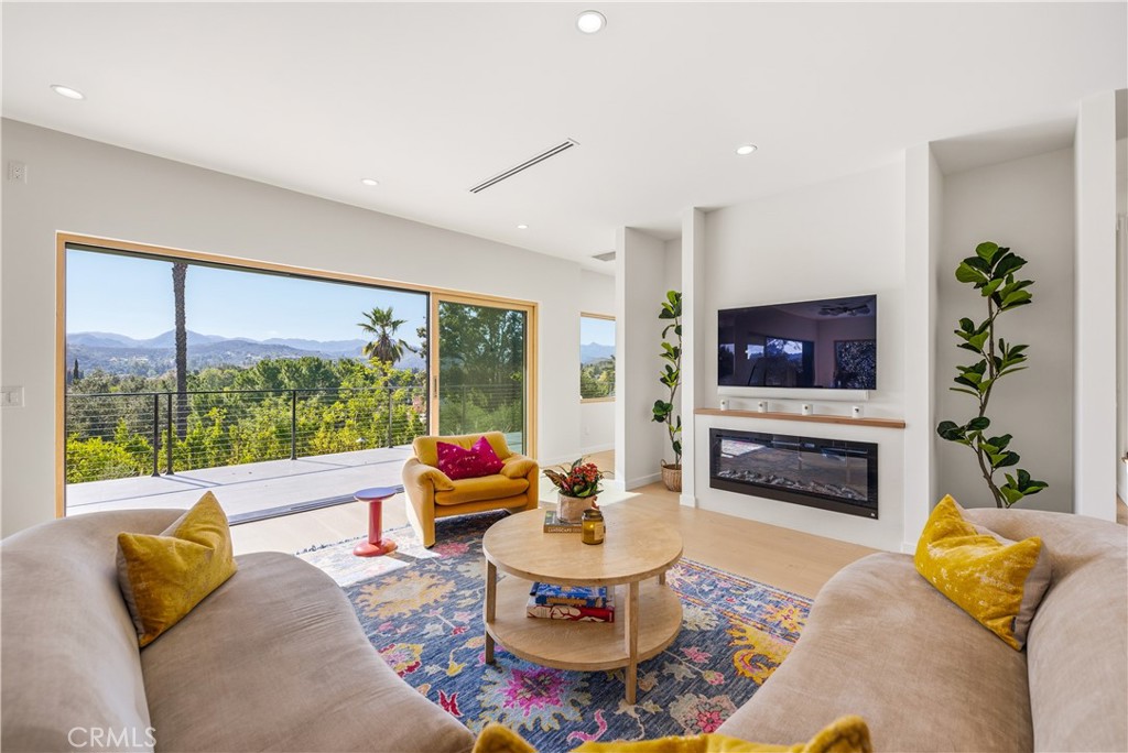 976 Ranch House Road Westlake Village, CA 91361 - Photo 7 of 42 Electric fireplace accents the living room