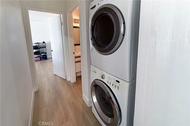 a view of a hallway with washer and dryer