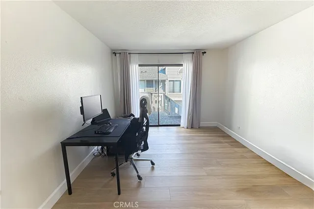 a workspace with furniture window and wooden floor