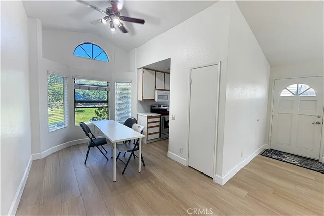 a view of a dining room with furniture window and wooden floor