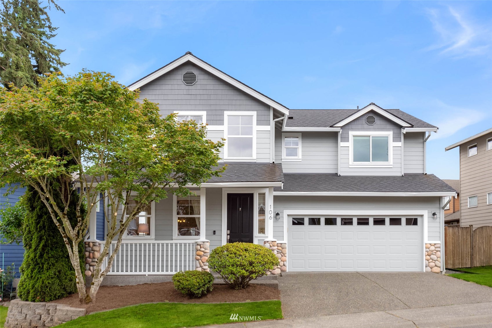 106 202nd Street Southeast Bothell, WA 98012 - Photo 1 of 32 a front view of a house with garden