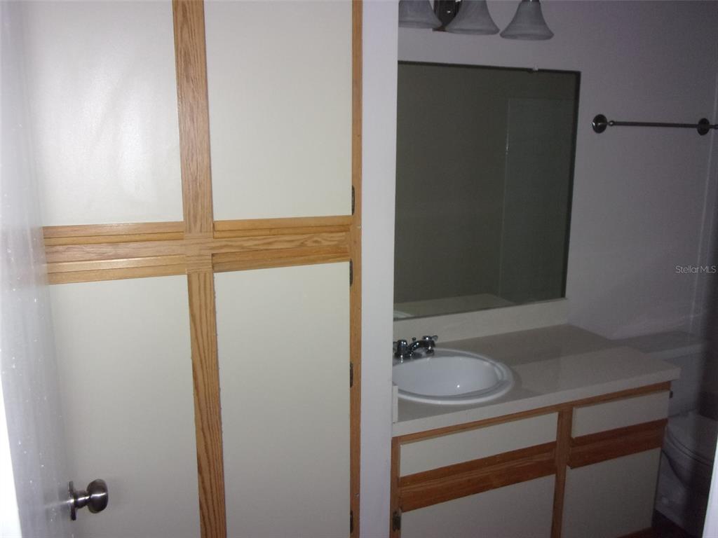 246 Afton Square, Unit 304 Altamonte Springs, FL 32714 - Photo 11 of 18 a bathroom with a sink a mirror and a shower