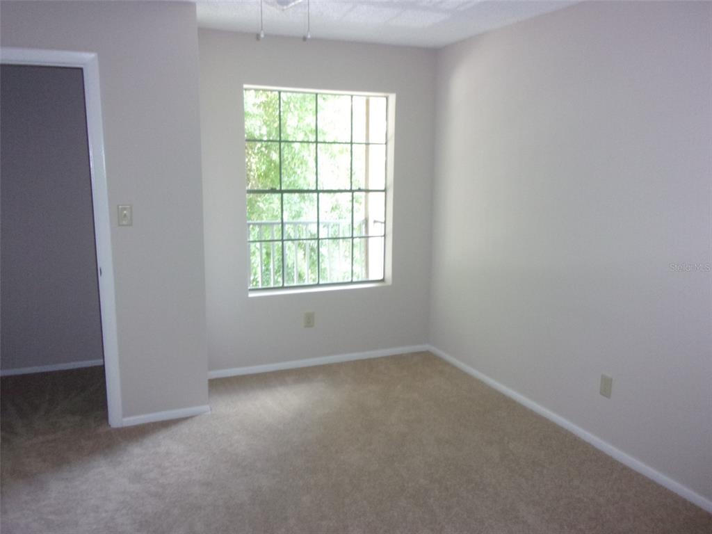 246 Afton Square, Unit 304 Altamonte Springs, FL 32714 - Photo 16 of 18 an empty room with a window