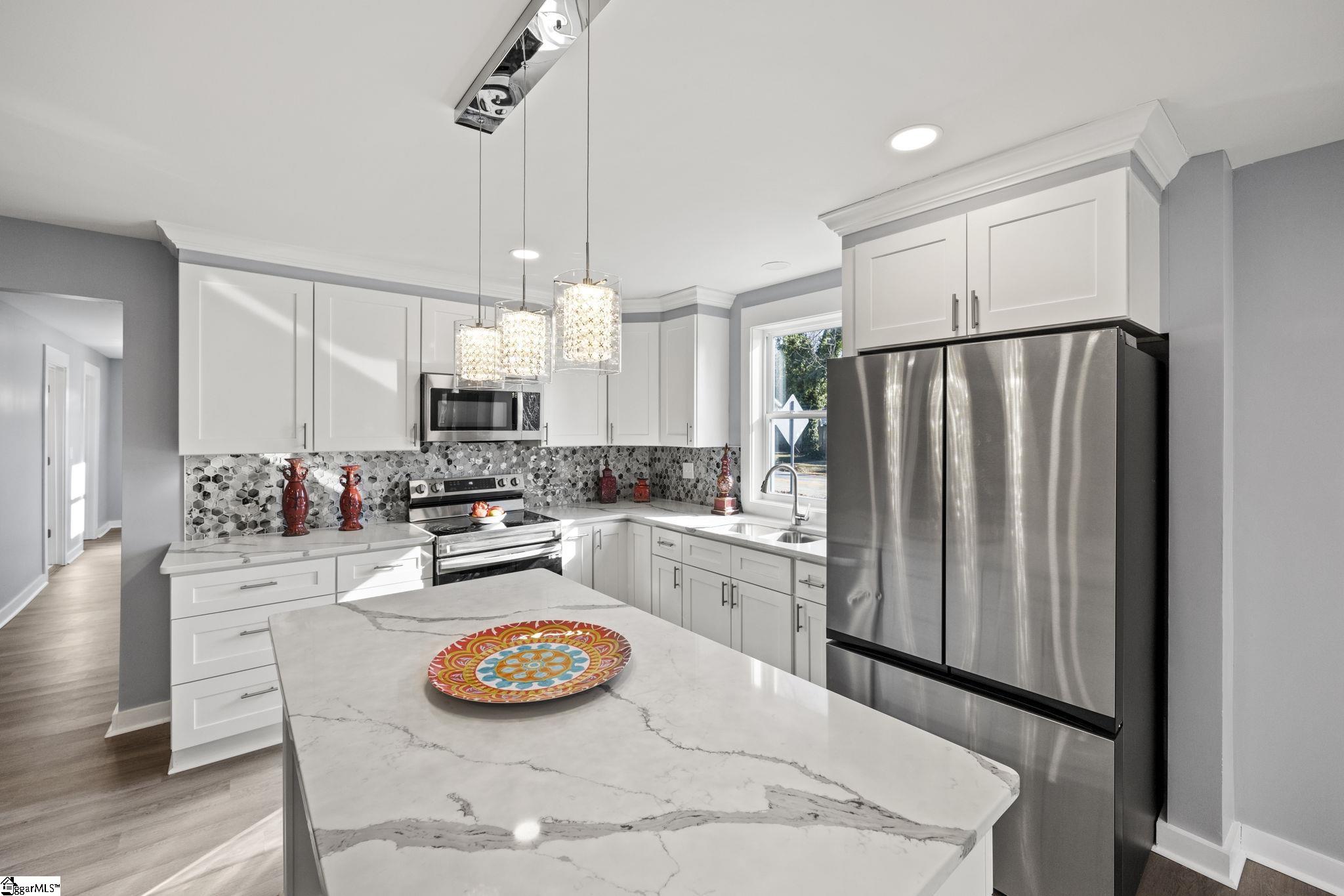 415 Blue Ridge Street Easley, SC 29640 - Photo 5 of 20 Extra seating at island in addition to the dining room.