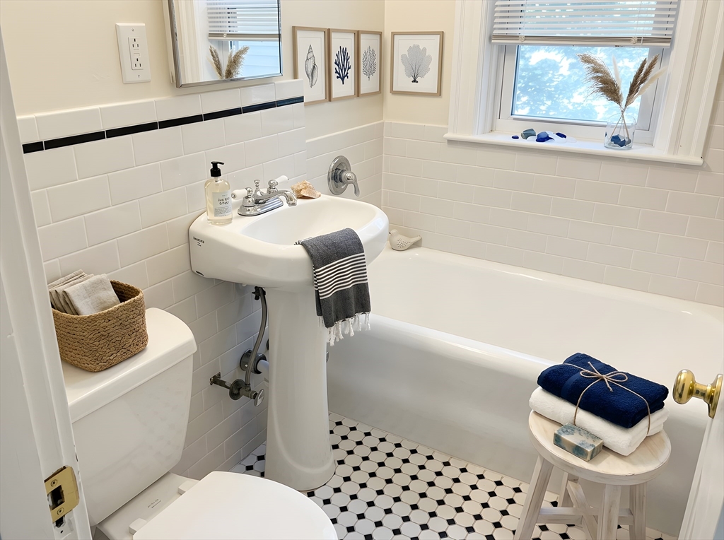 203-205 Winthrop Road, Unit 3 Brookline, MA 02445 - Photo 5 of 9 a bathroom with a sink toilet and shower