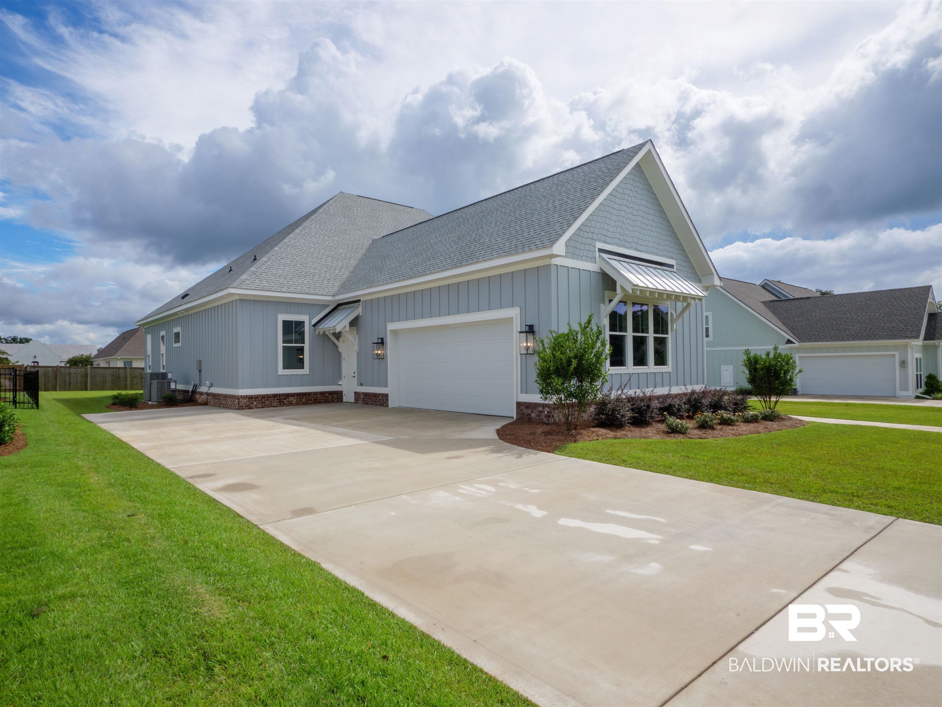 10912 Catania Avenue Fairhope, AL 36532 - Photo 5 of 54 Side view of home with garage entry