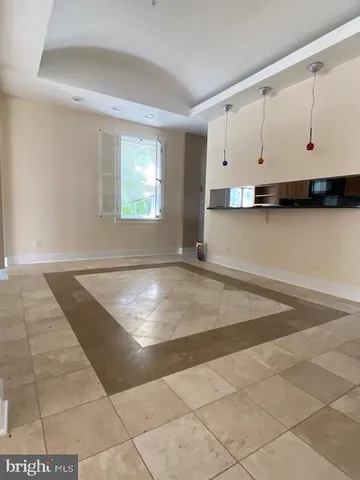 a view of a kitchen with kitchen appliances cabinets and a sink