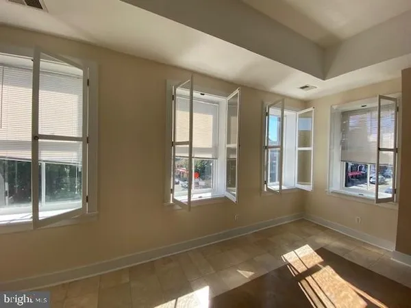 a view of an empty room with a window