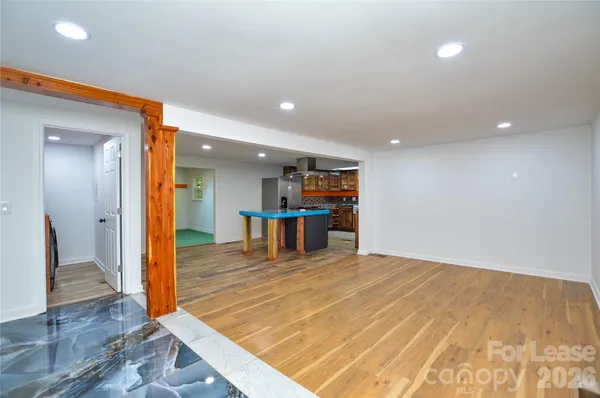 a kitchen with stainless steel appliances granite countertop a refrigerator and wooden cabinets