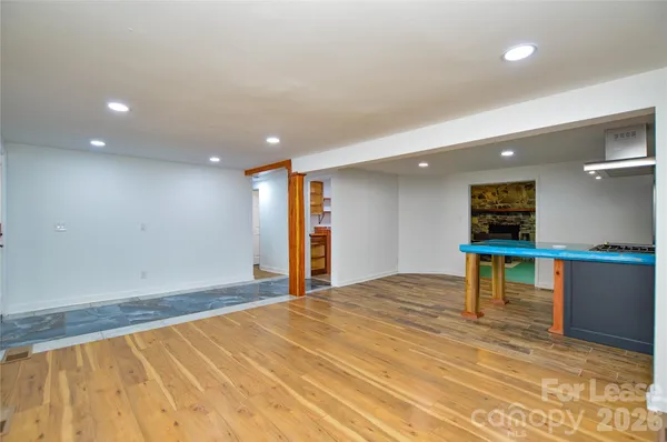 a bathroom with a shower a sink and a mirror