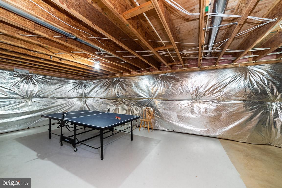 2944 Edgelea Road Vienna, VA 22181 - Photo 40 of 57 Unfiinished walk-up basement with ping pong table