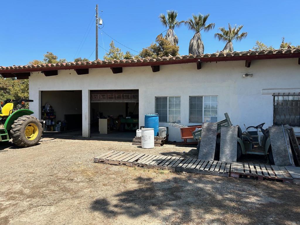 a view of a patio with table and chairs with wooden floor