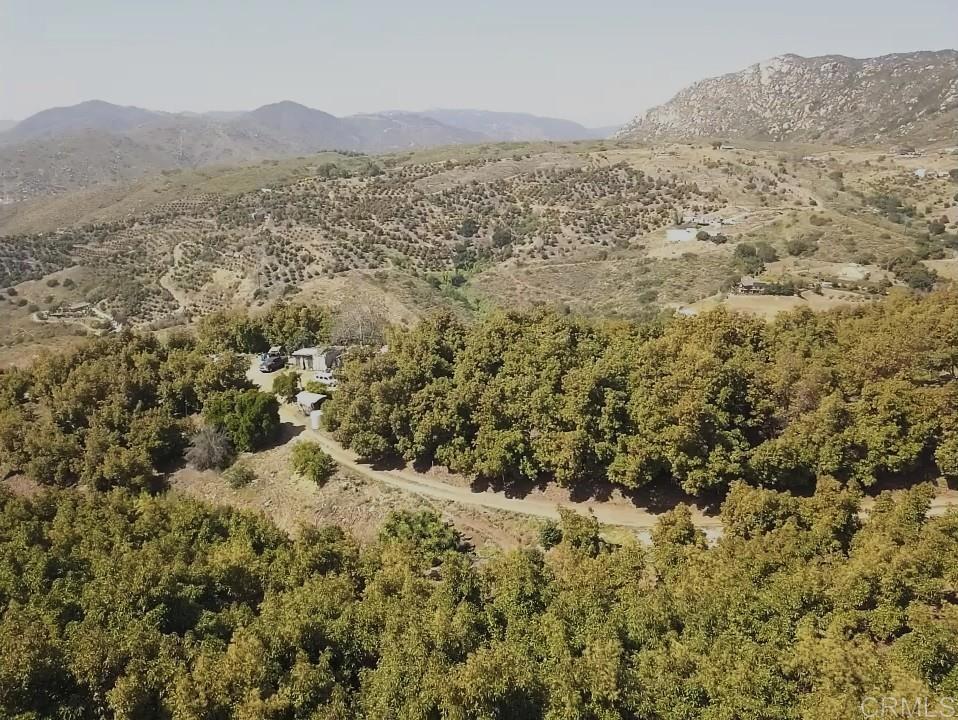 33444 Couser Canyon Road Valley Center, CA 92082 - Photo 5 of 11 a view of a large mountain with mountains in the background