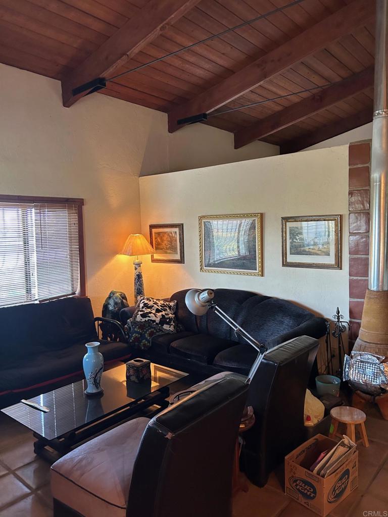 33444 Couser Canyon Road Valley Center, CA 92082 - Photo 7 of 11 a living room with furniture and wooden floor
