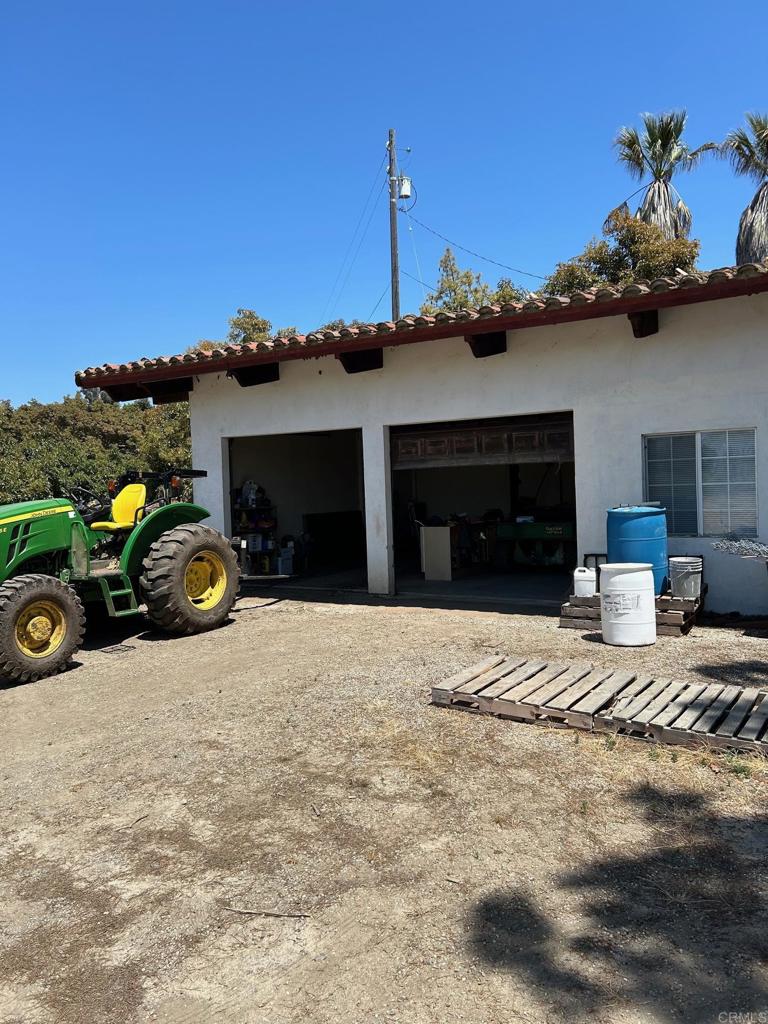 33444 Couser Canyon Road Valley Center, CA 92082 - Photo 10 of 11 a view of a house with a yard and garage