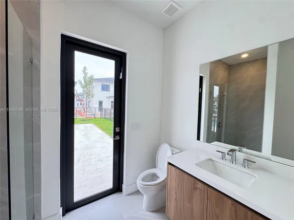 a view of a hallway with windows