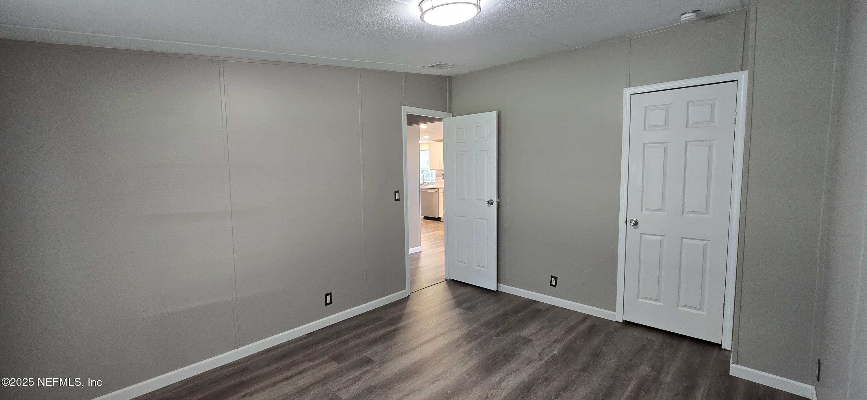 45028 Musslewhite Road Callahan, FL 32011 - Photo 18 of 18 a view of an empty room with wooden floor