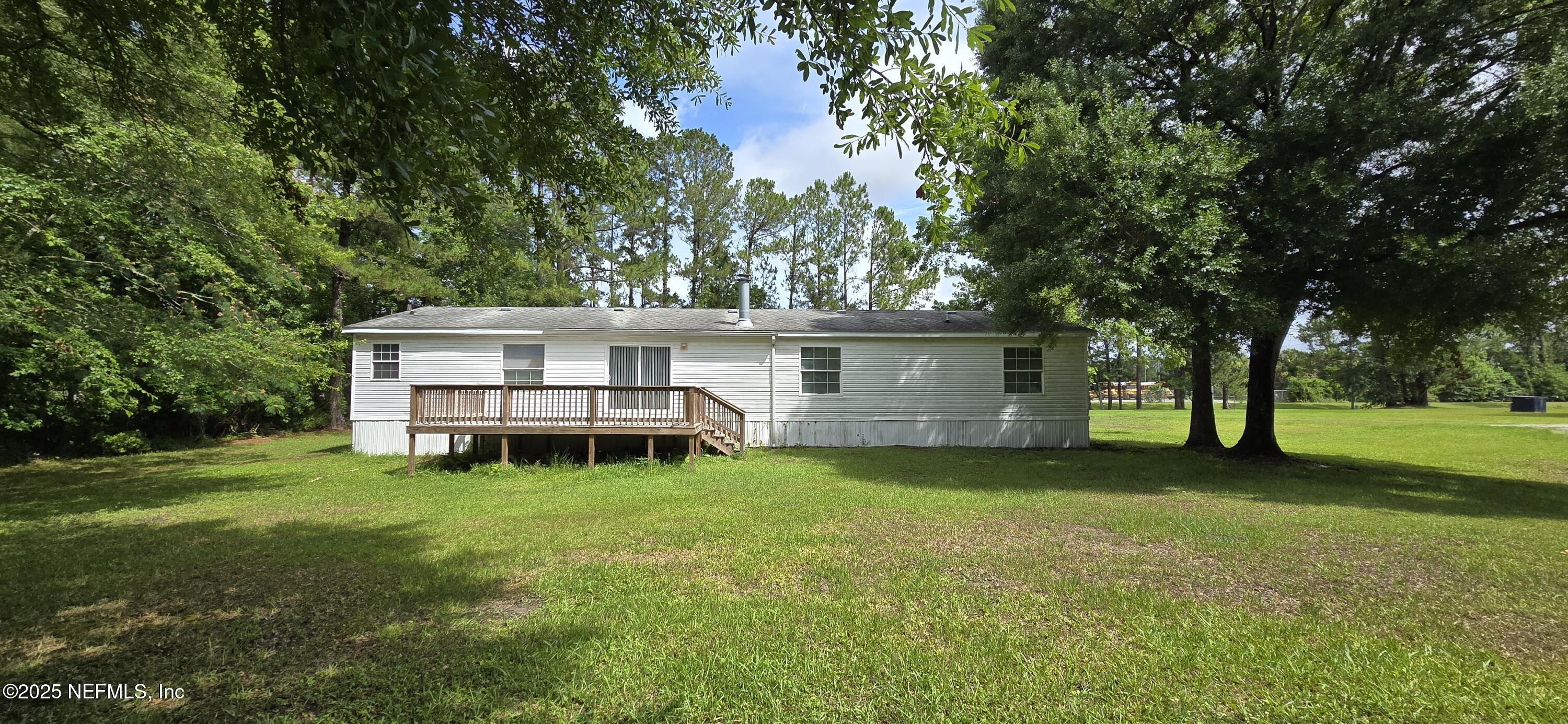 45028 Musslewhite Road Callahan, FL 32011 - Photo 4 of 18 a view of a house with a yard porch and tree