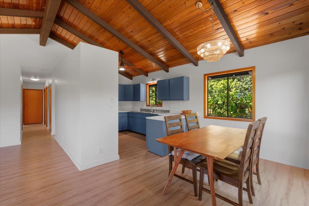 2130 Kauhikoa Road, Unit A Haiku, HI 96708 - Photo 11 of 43 a view of a dining room with furniture window and wooden floor