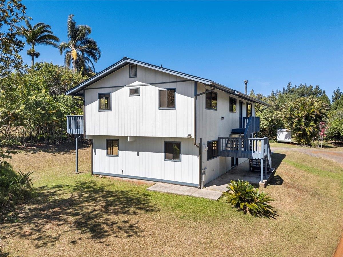 2130 Kauhikoa Road, Unit A Haiku, HI 96708 - Photo 12 of 43 a view of a house with a yard