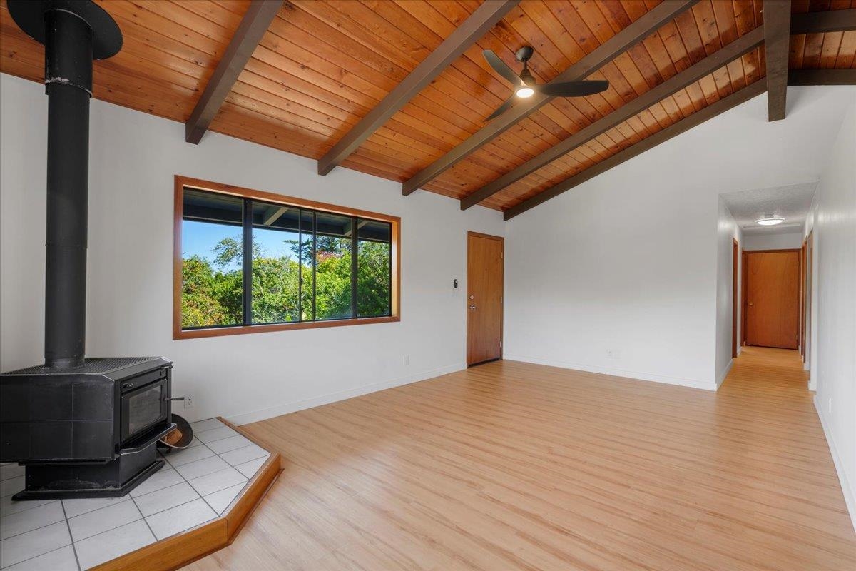 2130 Kauhikoa Road, Unit A Haiku, HI 96708 - Photo 15 of 43 a view of an empty room with wooden floor and a window