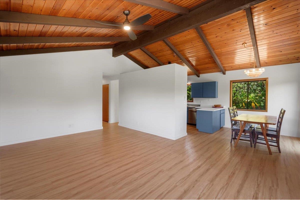 2130 Kauhikoa Road, Unit A Haiku, HI 96708 - Photo 17 of 43 a view of a room with wooden floor and furniture
