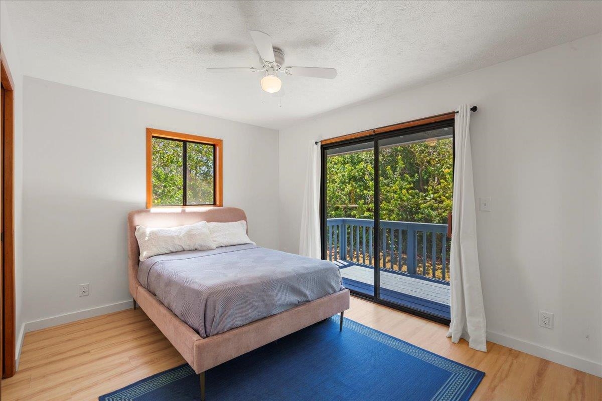 2130 Kauhikoa Road, Unit A Haiku, HI 96708 - Photo 18 of 43 a bedroom with a bed and window
